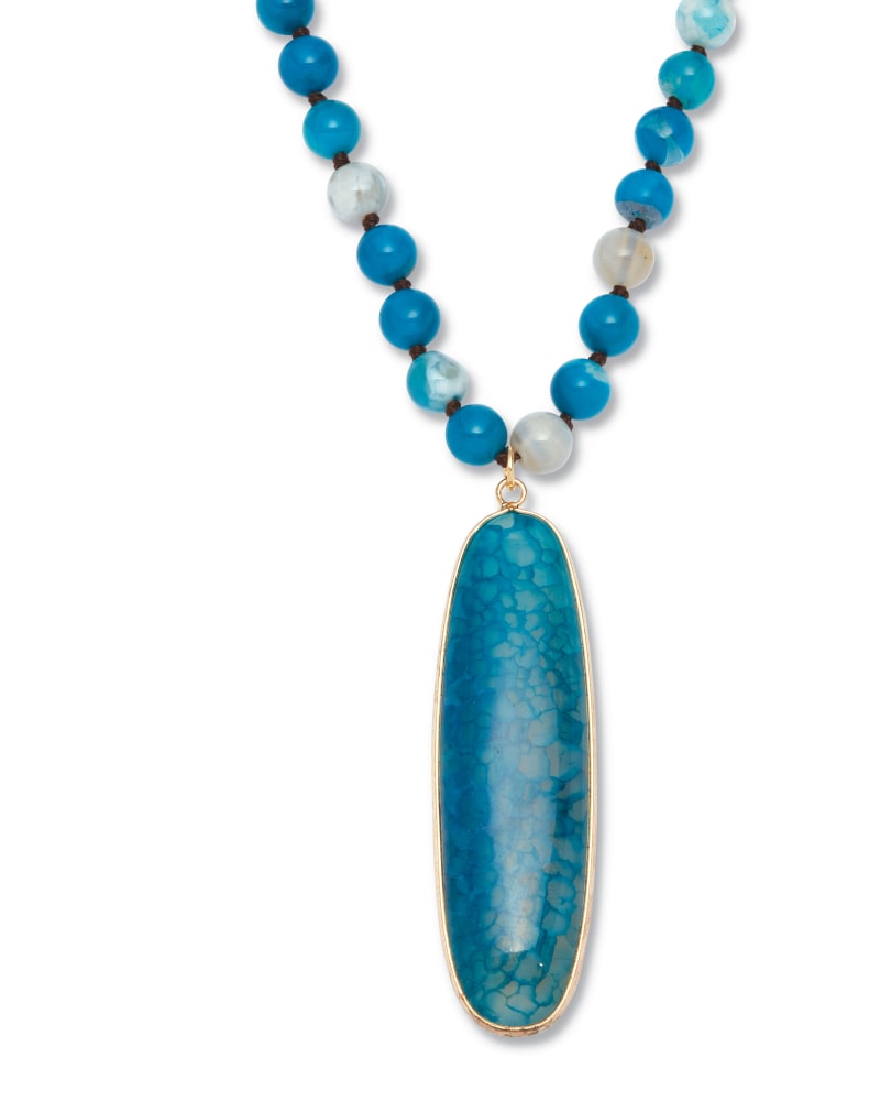 Front of a size 34 in Genuine Blue Agate Cabochon Goldtone Drop Necklace, 34 inches in Blue by PalmBeach Jewelry. | dia_product_style_image_id:333185